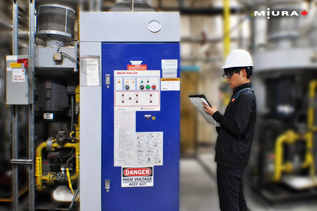 Japanese Trainee checking a boiler